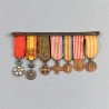 BARRETTE DE 7 REDUCTIONS MEDAILLES MILITAIRES D'UN ANCIEN DE LA PREMIERE GUERRE LEGION D'HONNEUR NICHAN IFTIKHAR