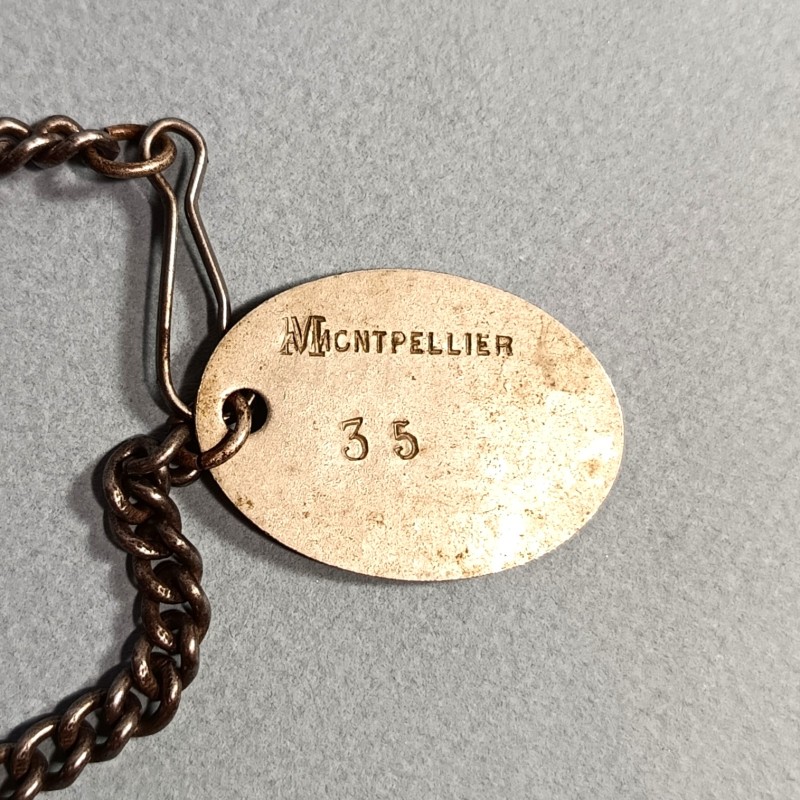 PLAQUE D'IDENTITE MILITAIRE TROUPE VIGUIER MARIUS CLASSE 1895 MONTPELLIER MATRICULE 35 GUERRE 1914-1918 AVEC SA CHAINE